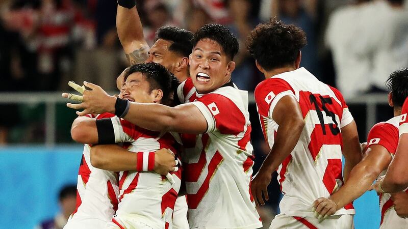 Japan celebrate their win over Ireland in Shizuoka. Photograph: Stu Forster/Getty