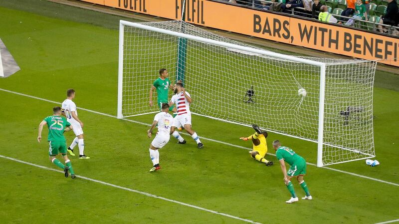 Burke scores the equaliser for Ireland. Photo: Oisin Keniry/Inpho