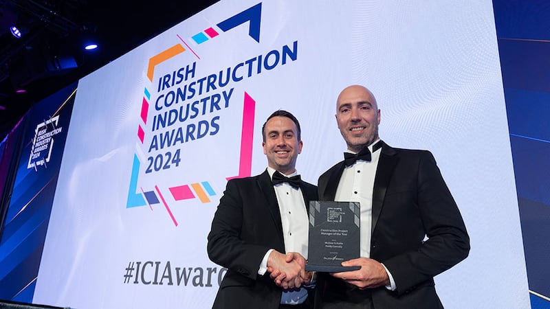 Joe Cullen, operations manager at Falcon Green, presents the construction project manager of the year award to Mark McCormick on behalf of Paddy Connolly, McAleer & Rushe