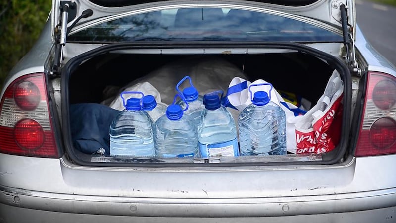 Rosemary Bruen fills the boot of her car with water from a well outside Keadue, Co Roscommon. Photograph: Bryan O’Brien/The Irish Times