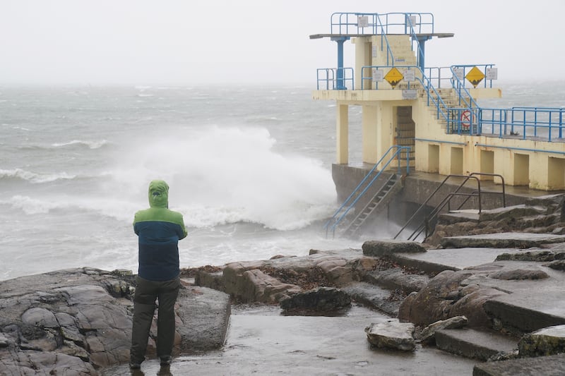 A person watches the waves at the Blackrock diving tower in Salthill, Galway. Photograph: Brian Lawless/PA Wire