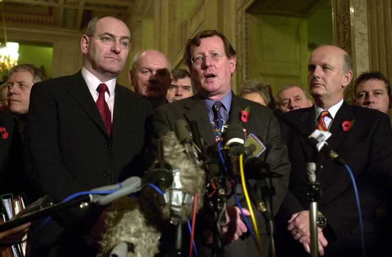 Mark Durkan (left) and David Trimble (centre) at Stormont after their election as deputy first minister and first minister respectively in 2001. Photograph: Leon Farrell/RollingNews.ie