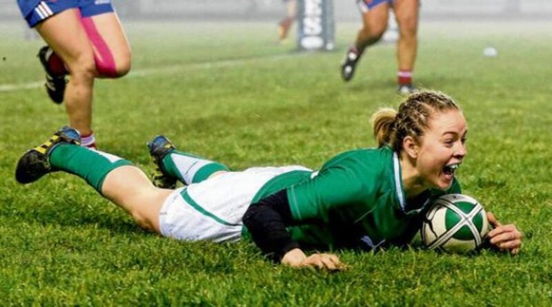 Ireland's fullback Niamh Briggs goes over the French line to score a try during last night's Women's Six Nations Championship clash at Ashbourne RFC. Photograph: Dan Sheridan/Inpho