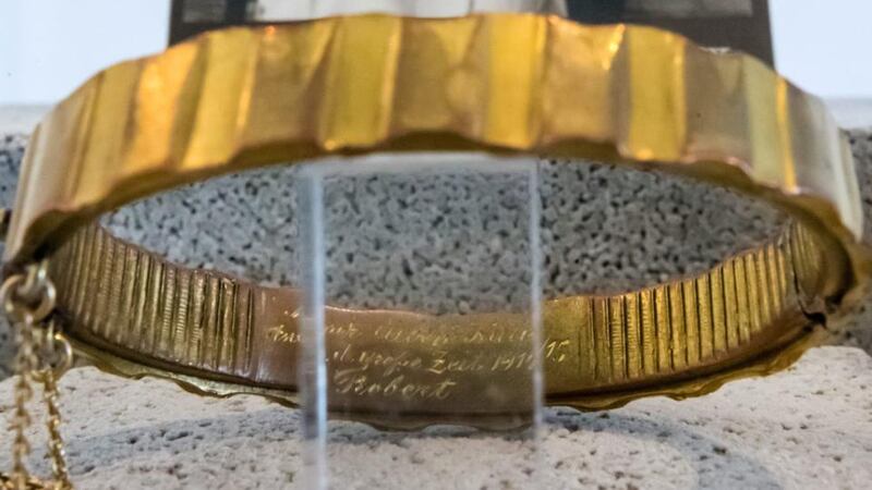 A bracelet made from a grenade driving band on display at the exhibition Terribly Beautiful: Wartime Memories made of Ammunition at the City Museum in Erfurt, Germany. Photograph: EPA/Michael Reichel