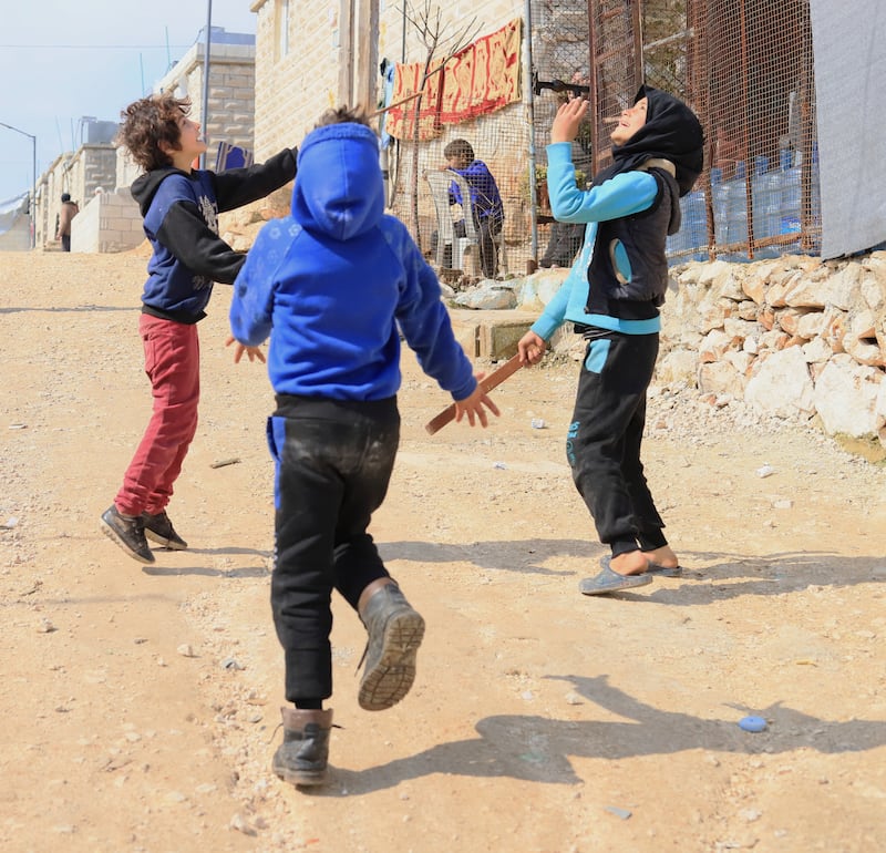 Hamoud’s children are playing in the displacement camp where the family has lived for over a year. Idleb, Syria. February 2024