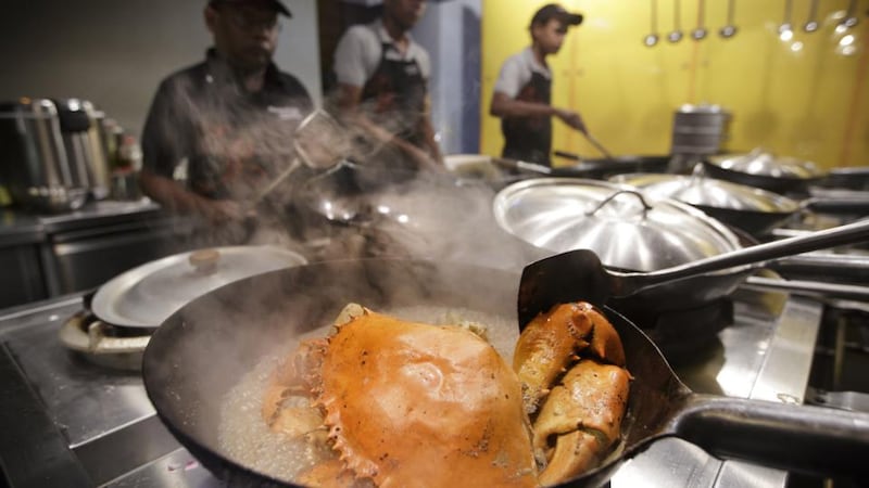 Shellfish central: The Ministry of Crab is located in the much-lauded Old Dutch Hospital, a restored 17th-century building. The restaurant serves fresh crabs in garlic, chilli, butter and pepper variations. Photograph: Kuni Takahashi