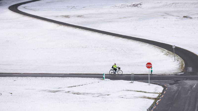  A lone cyclist on the snow covered Currgagh Plains in Co Kildare on Friday. Photograph: Eamonn Farrell/RollingNews.ie