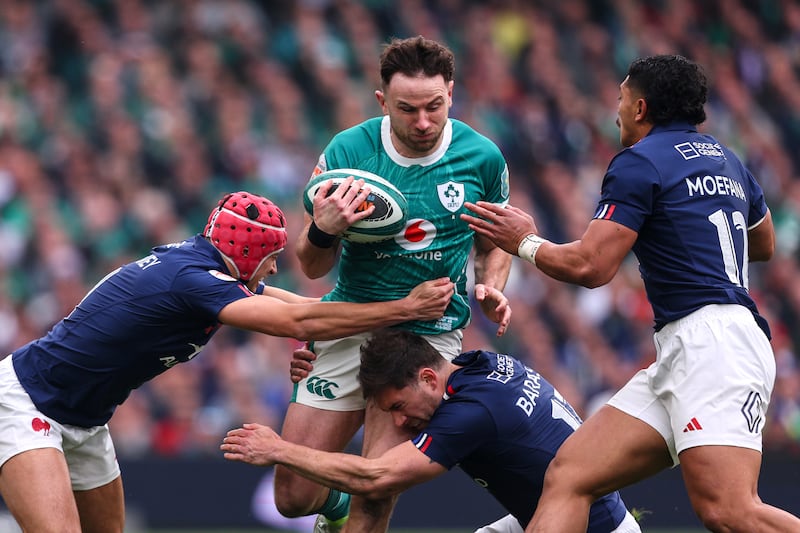 Ireland's Hugo Keenan runs into traffic during the Six Nations game against France. Photograph: Ben Brady/Inpho   