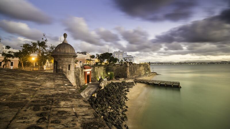 Old San Juan in Puerto Rico, at dusk: the city of San Juan is a hub for cruise ships plying the Caribbean and its main airport is one of the busiest in the region. Photograph: iStock