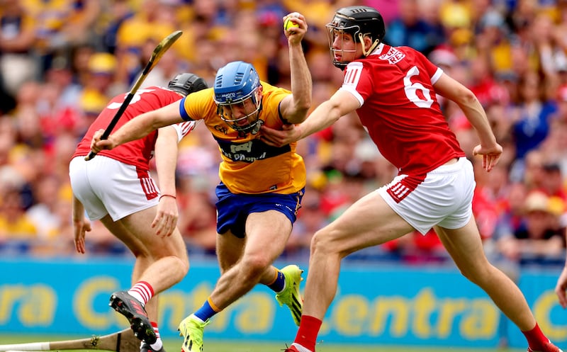 Clare’s Shane O'Donnell in action against Eoin Downey and Robert Downey of Cork during last July's All-Ireland hurling final at Croke Park. Photograph: James Crombie/Inpho