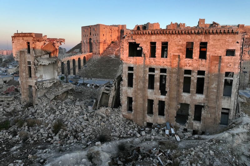 This aerial view shows the landmark citadel of Aleppo and its surroundings damaged by the civil war, after jihadists and their allies entered the northern Syrian city, early on Saturday. Photograph: Omar Haj Kadour/AFP/Getty Images