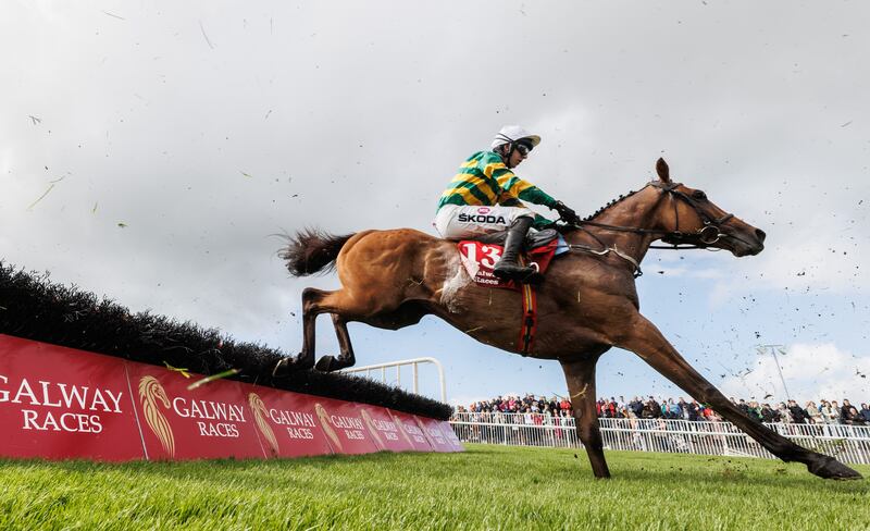 Mark Walsh on Mystical Power in action during the Galwaybayhotel.com & TheGalmont.com Novice Hurdle at Galway. Photograph: James Crombie/Inpho 