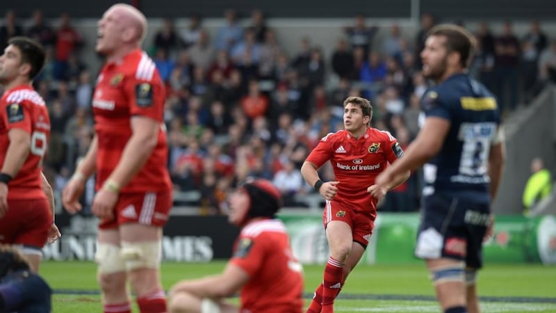 Ian Keatley of Munster looks as his last-gasp drop goal sails between the Sale posts   at AJ Bell Stadium. Photograph:  Gareth Copley/Getty Images