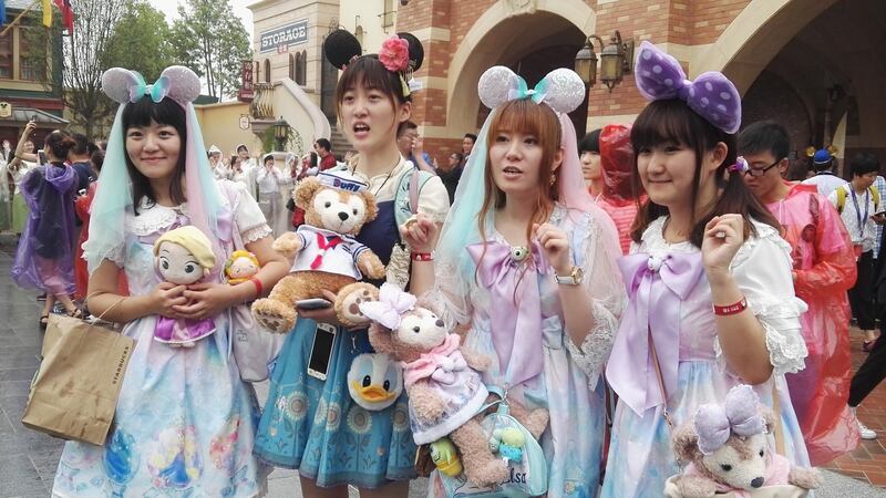 Disney selfies: young Shanghai women in frilly dresses and Minnie Mouse headbands photograph each other furiously. Photograph: Visual China/Getty