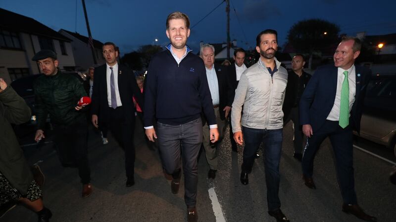 Donald Trump jnr (second right), and Eric Trump (centre) walking in the village of Doonbeg  on the first day of US president Donald Trump’s visit to Ireland. Photograph:  Brian Lawless/PA