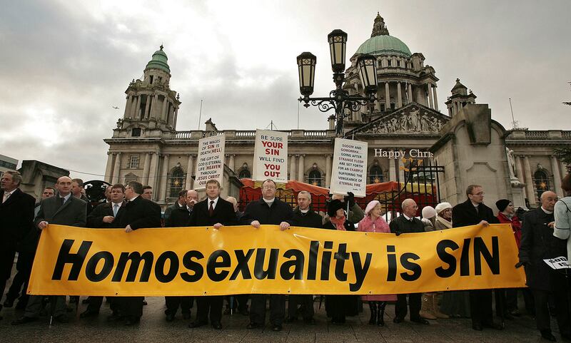 Protesters stand outside Belfast City Hall during the civil partnership ceremony of Gráinne Close and Shannon Sickels in December 2005. Photograph: Peter Macdiarmid/Getty