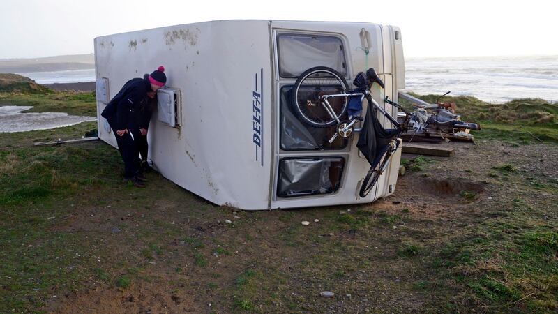 An overturned  caravan  near the beach at Garretstown, Co Cork. Photograph:   Denis Boyle