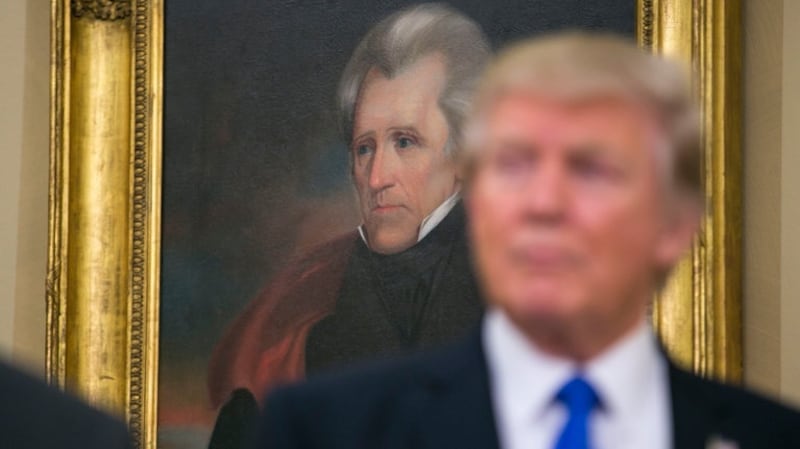 Donald Trump: the 45th US president has hung Andrew Jackson’s portrait in the Oval Office. Photograph: Al Drago/New York Times