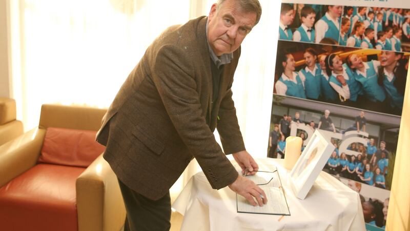 RTÉ broadcaster Bryan Dobson signs the book of condolence for his late colleague Marian Finucane at RTÉ Radio Centre in Dublin. Photograph: Stephen Collins/Collins Photos