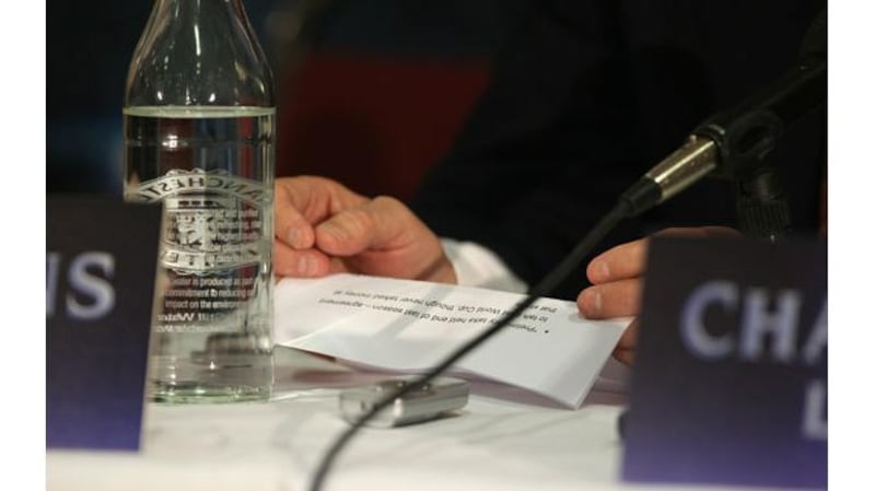 Alex Ferguson consults his notes during this afternoon’s extraordinary press briefing on Wayne Rooney’s future. Photograph: Alex Livesey/Getty Images