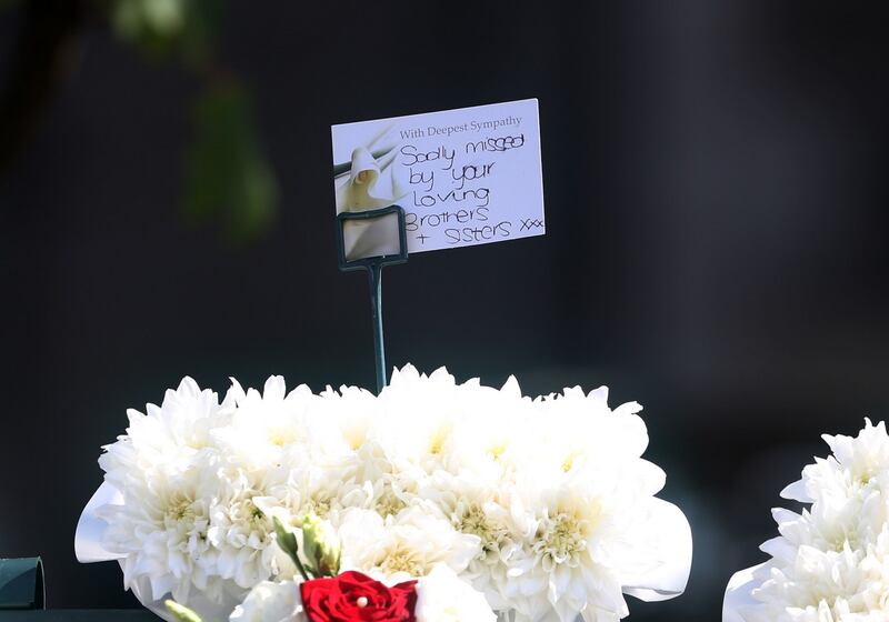 A message on flowers as the remains of John Hutch are carried from his home to the Church of the Holy Family. Photograph: Colin Keegan/Collins Dublin