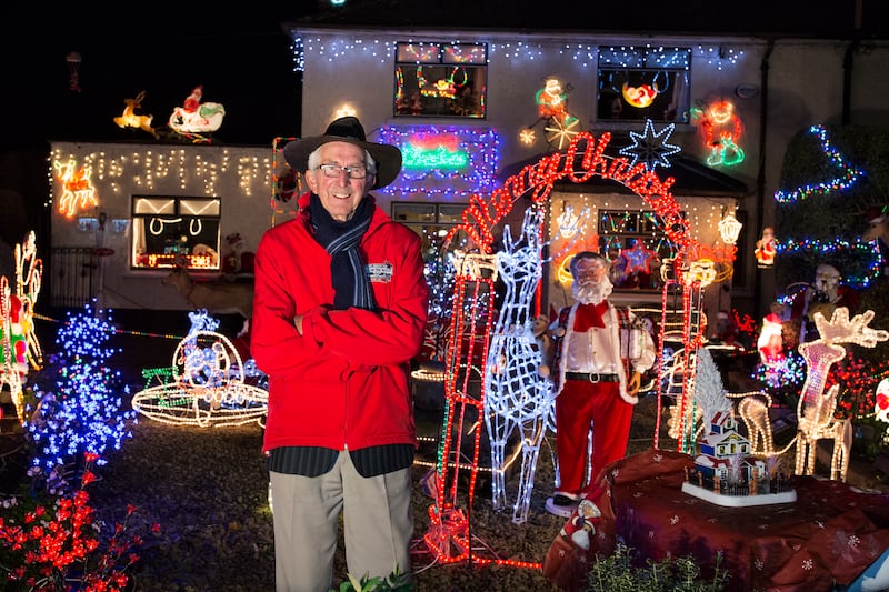 William Tilly, raising money and bringing cheer with the Christmas lights display at his home in Dublin. Photograph: Malcolm McGettigan