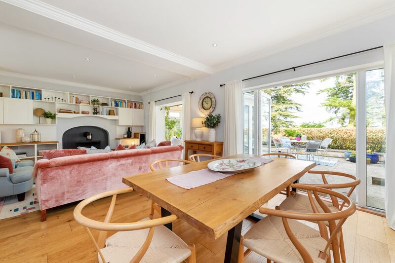 The dining area opens to a sun-trap patio