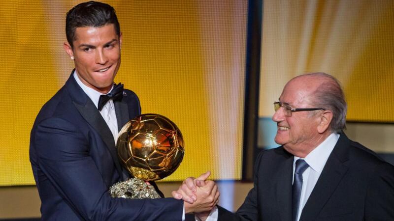 Fifa Ballon d’Or winner Cristiano Ronaldo of Portugal and Real Madrid  shakes hands with Fifa president Sepp Blatter upon receiving his award. Photograph: Philipp Schmidli/Getty Images