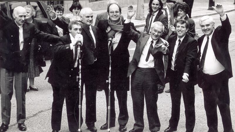 The Birmingham Six with Chris Mullin MP (centre) outside the Old Bailey in London following their release: (from left) John Walker, Paddy Hill, Hugh Callaghan, Richard McIIkenny, Gerry Hunter and William Power. Behind them is Paul Hill of the Guildford Four. Photograph: Joe St Leger