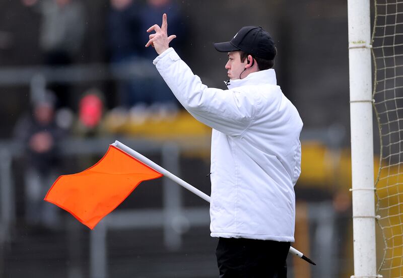 An umpire signals a two-point score in the game between Westmeath and Louth. Photograph: James Crombie/Inpho