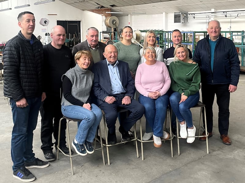 Denis O'Brien (centre) with the rest of the staff of DYR Electrical in Carrick-on-Shannon. Photograph: Ronan McGreevy