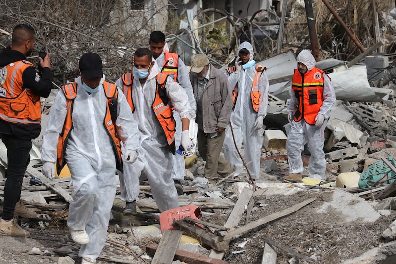 Palestinian civil defence personnel search for bodies amidst the rubble of buildings in a ruined neighbourhood of Gaza's southern city of Rafah, on on Wednesday. (Photograph: Bashar Taleb/AFP via Getty Images