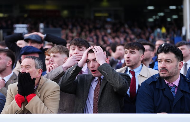 Racegoers at Cheltenham react after Constitution Hill falls in the Unibet Champion Hurdle. Photograph: David Davies for The Jockey Club/PA Wire