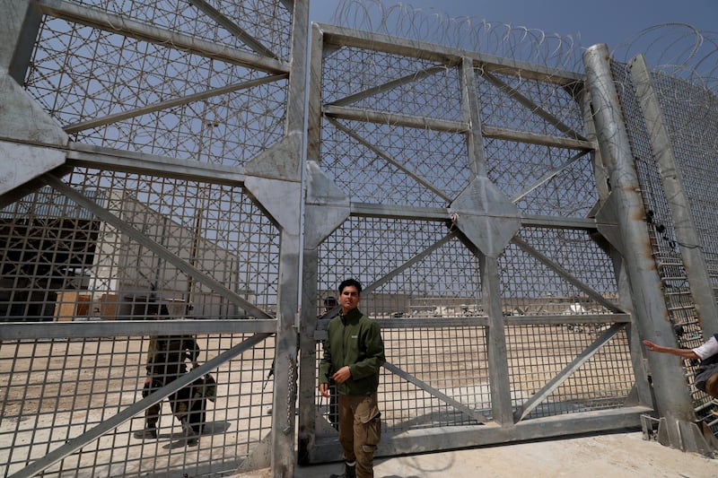 Israeli soldiers stand guard as trucks carrying humanitarian aid to the northern part of the Gaza Strip are checked before entering the Erez Crossing, at the border between Israel and northern Gaza. Photograph: Atef Safadi/EPA