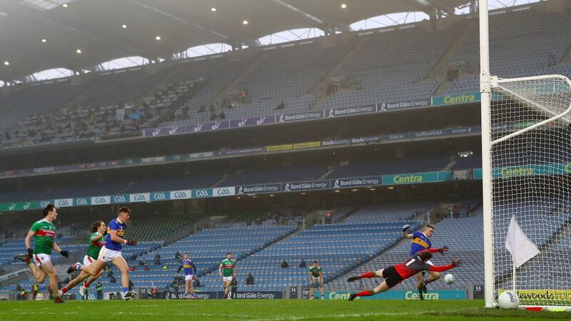 Michael Quinlivan sees a shot saved by David Clarke. Photograph: James Crombie/Inpho