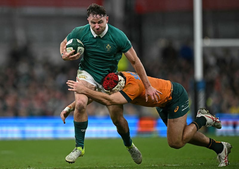 Keenan is tackled by Australia's flanker Fraser McReight. Photograph: Ben Stansall/AFP