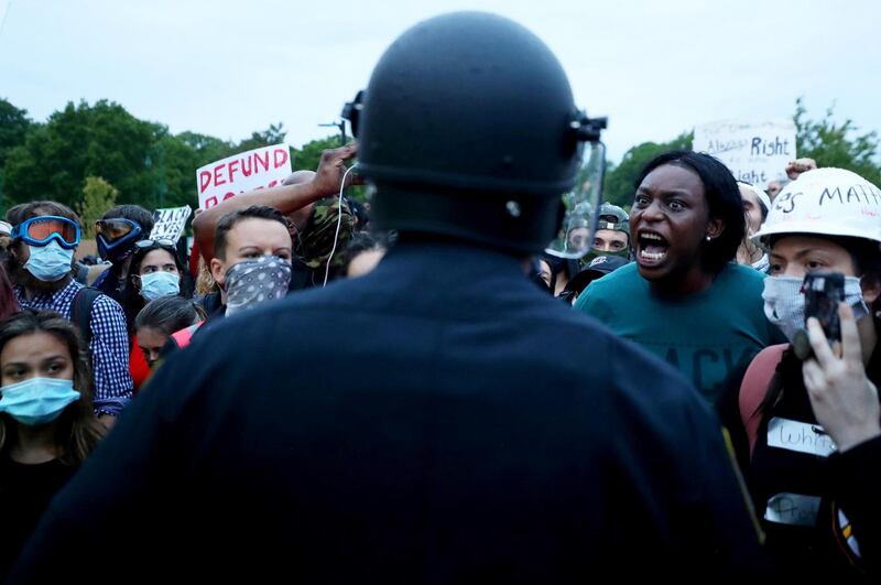 Protesters confront police in Boston.  Photograph: Maddie Meyer/Getty