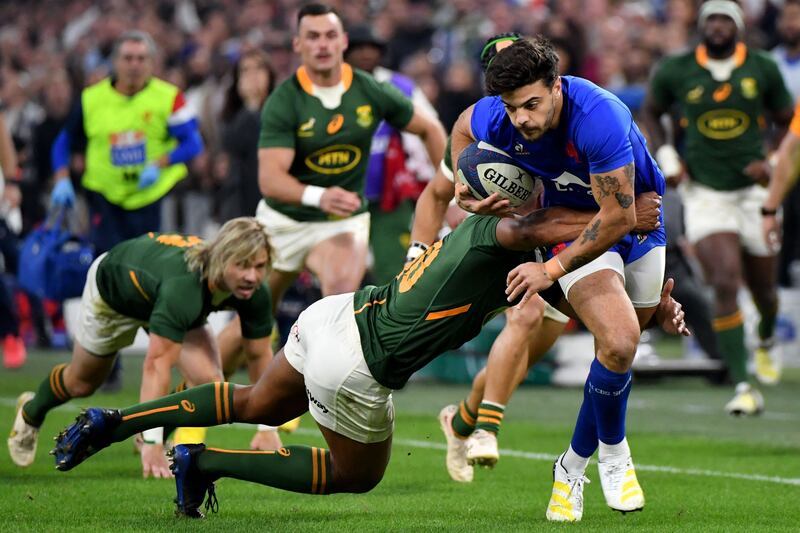 France's flyhalf Romain Ntamack is tackled by South Africa's flyhalf Damian Willemse during a  Autumn Nations Series match between France and South Africa at the Velodrome stadium in Marseille, France,  on November 12th, 2022. Photograph: Sylvain Thomas/AFP