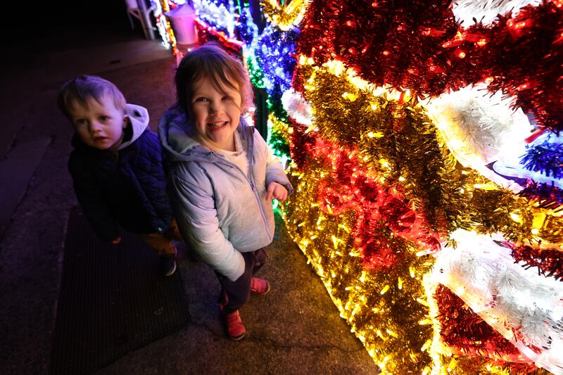 Aoife (3) and Tom (2) Farnan, from James Street, Dublin, visiting Josie's Christmas Lights in Crumlin, Dublin. Photograph: Nick Bradshaw