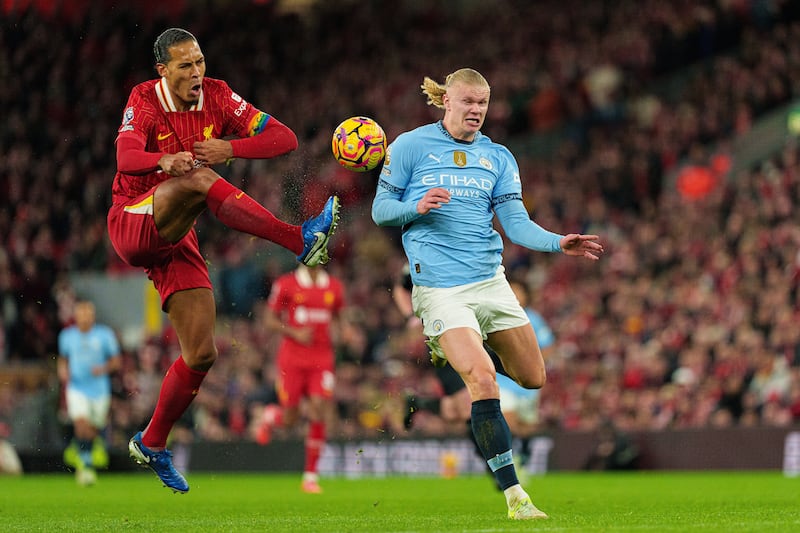 Liverpool's Virgil van Dijk is in action with Manchester City's Erling Haaland. Photograph: MI News/NurPhoto via Getty