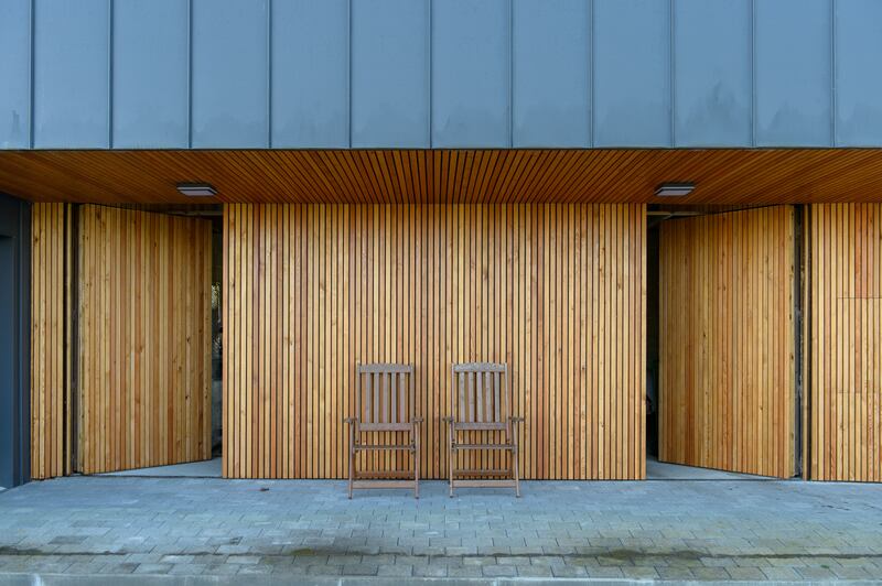 Seamless larch doors open into a garage and loft