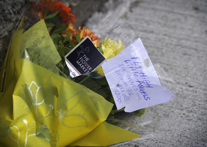 Flowers at the scene in the Rossfield Estate in Tallaght. Photo: Niall Carson / PA