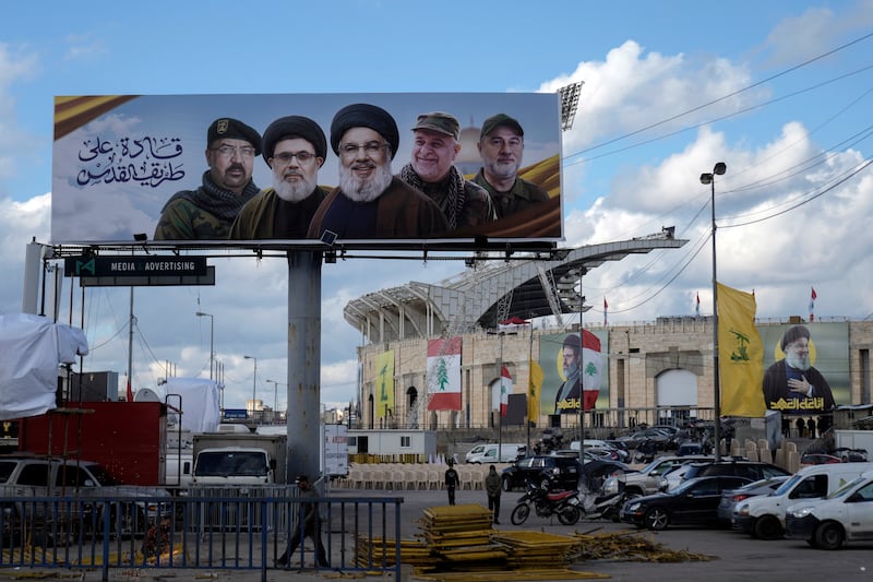 A billboard in Beirut with pictures of prominent figures including late Hizbullah leader Hassan Nasrallah (centre). Photograph: Bilal Hussein/AP