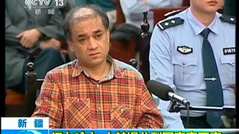 Uighur academic Ilham Tohti  from Minzu University of China sits during his trial on separatism charges in this still image taken from video shot on September, 2014. Photograph: Reuters