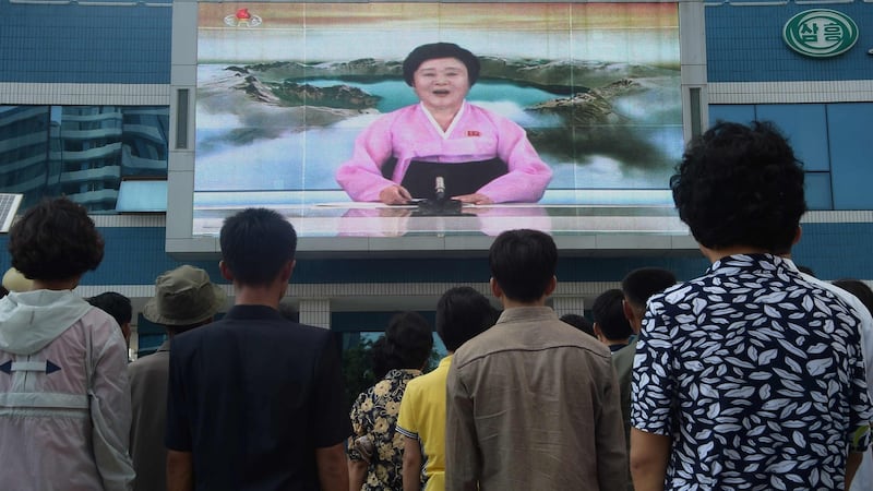 North Korea: residents on a Pyongyang street  watch Ri Chun-hee announce that the country has tested a hydrogen bomb. Photograph:  Kim Won-Jin/AFP/Getty