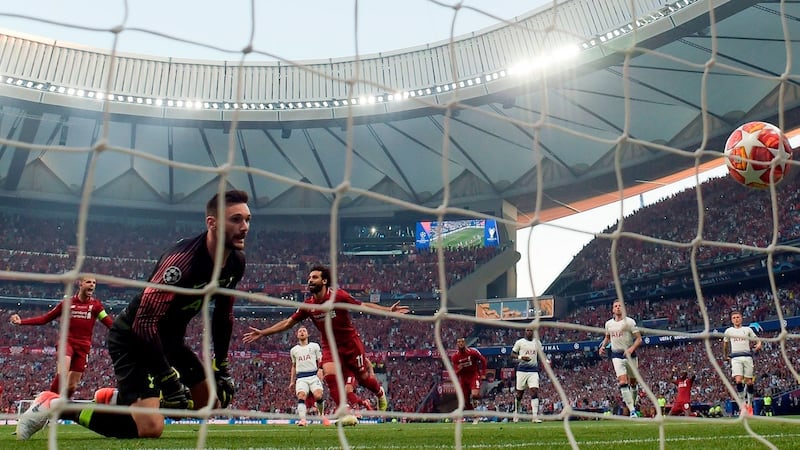 Liverpool’s Mohamed Salah  celebrates scoring from the penalty spot past Tottenham Hotspur goalkeeper Hugo Lloris during the  Champions League final at the Wanda Metropolitano Stadium in Madrid. Photograph: Gabriel Bouys/AFP/Getty Images