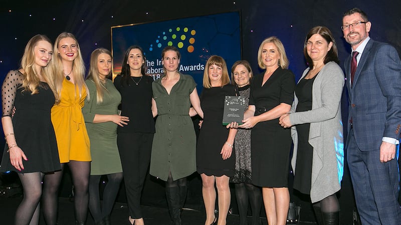 Lisa Keating, Scientific Programme Manager, Programmes Directorate, Science Foundation Ireland, presents the Laboratory Team of the Year award to Microbiology Laboratory, Tallaght University Hospital team.