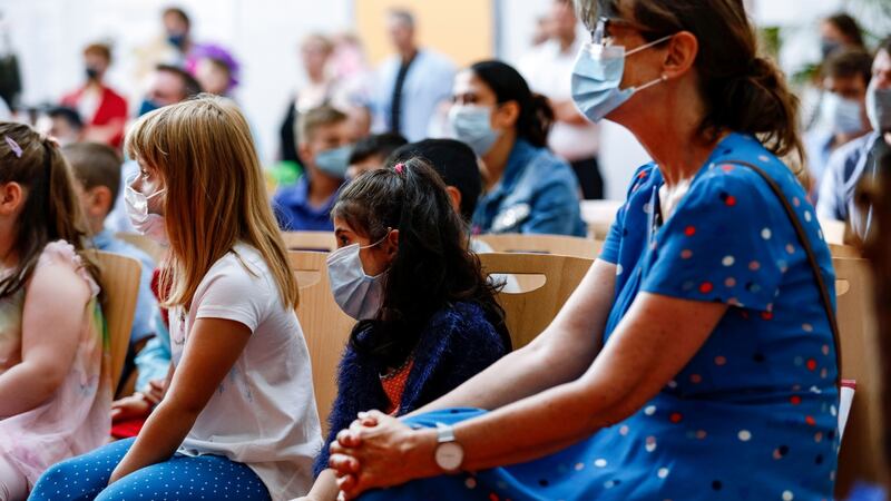 New pupils Angelina Bojahr (left) and Sandra Salit wear face masks during an enrolment ceremony at Lankow elementary school in Schwerin, Germany, at the weekend. Photograph: Felipe Trueba/EPA