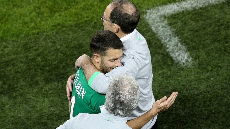 Ireland’s Wes Hoolahan is embraced by Ireland   O’Neill after being substituted against Moldova. Photograph: Gary Carr/Inpho