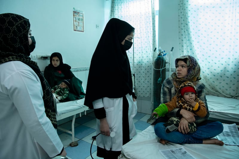 Nurses at a hospital tend to children getting treatment for severe pneumonia, in the Guzarah District of Afghanistan, in February. The Taliban administration has barred girls from high schools, universities and most job but the ban does not apply to health professionals. Photograph: Kiana Hayeri/The New York Times